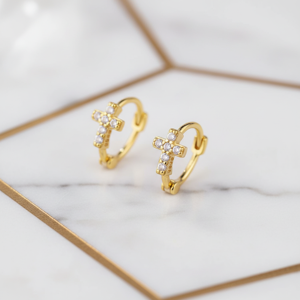 Gold cross hoop earrings - angled view